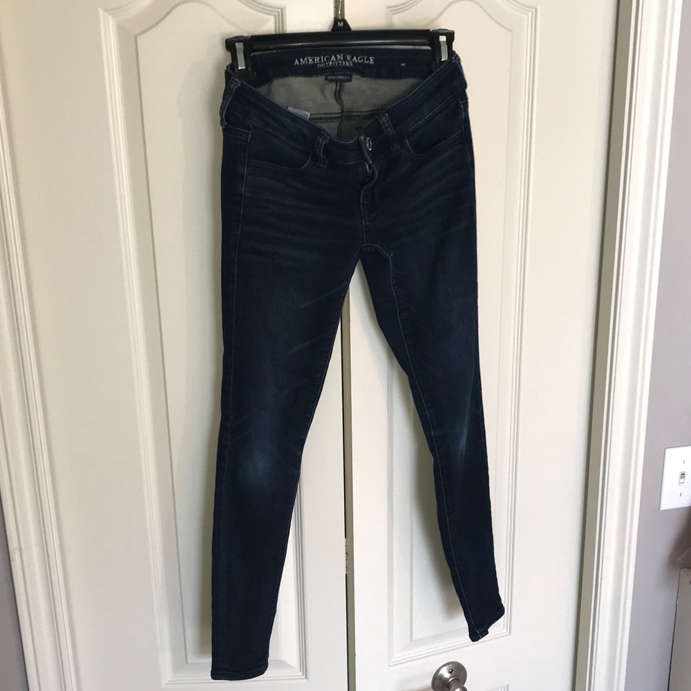 Super low rise dark blue jeans American Eagle